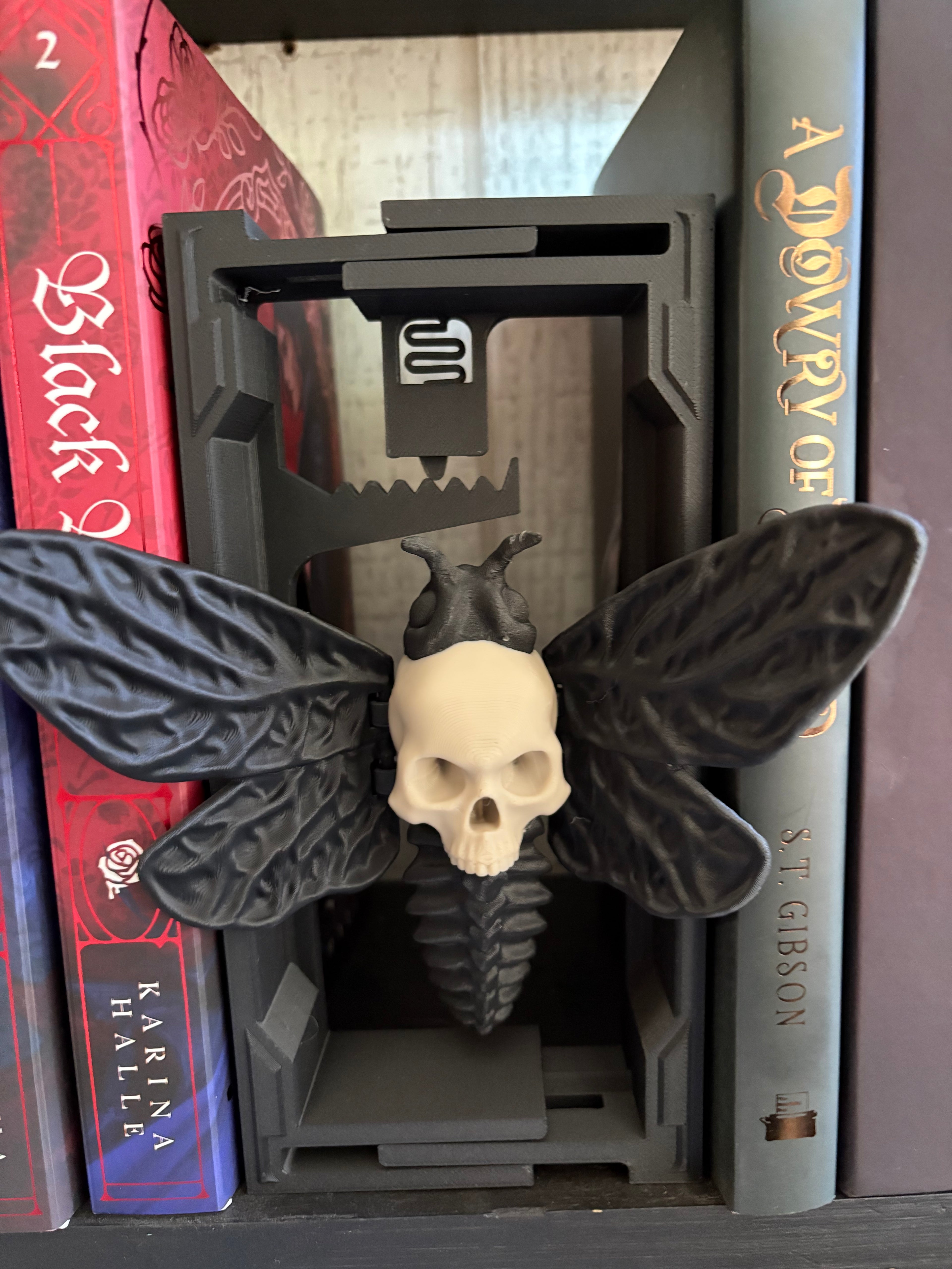 Skull wing moth book spacer